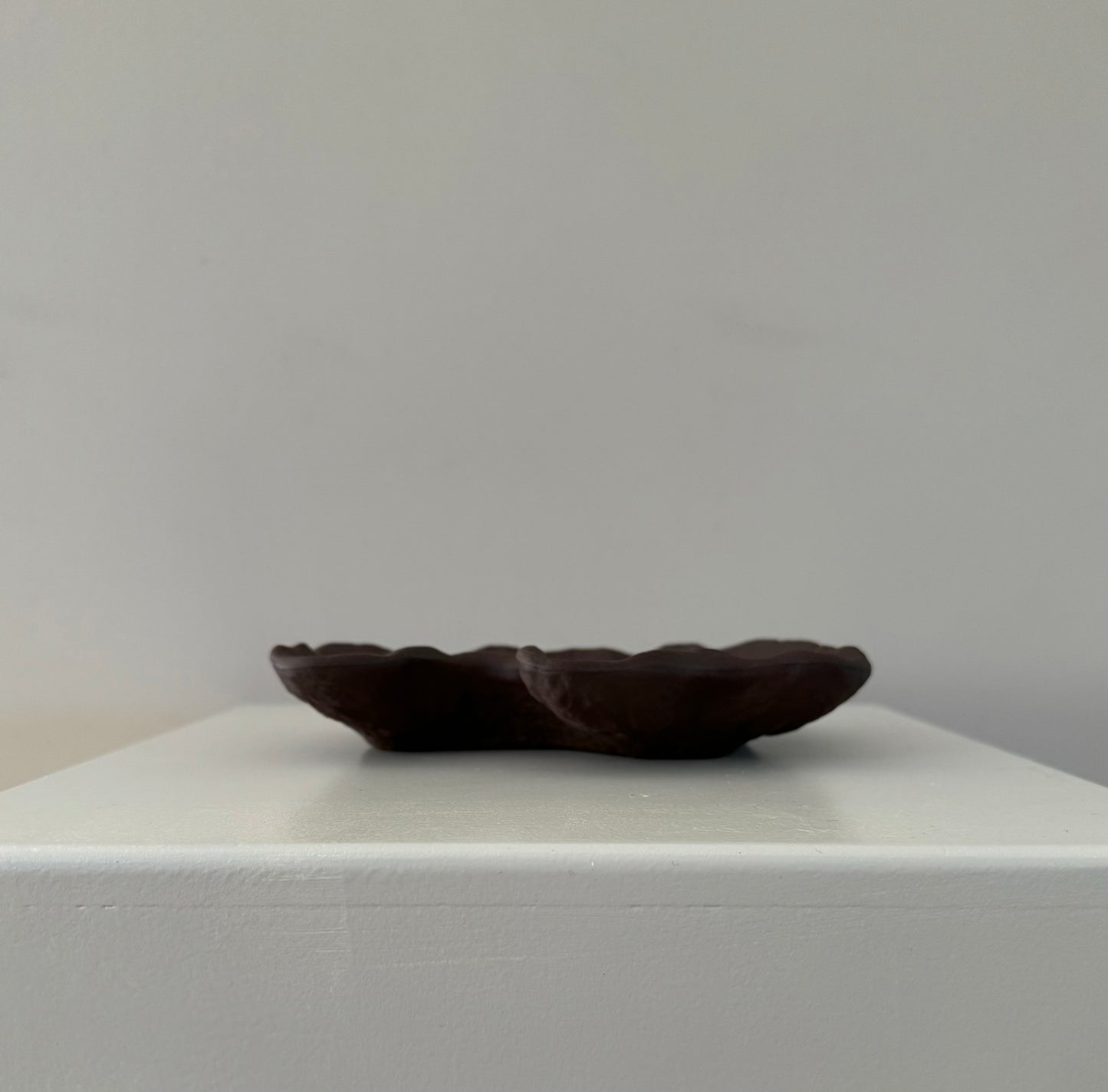 small brown puddle shape dish clay