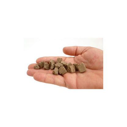 Hand holding BioGold Original organic bonsai fertiliser pellets